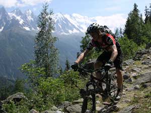mountain biker riding a rocky trail in Chamonix France